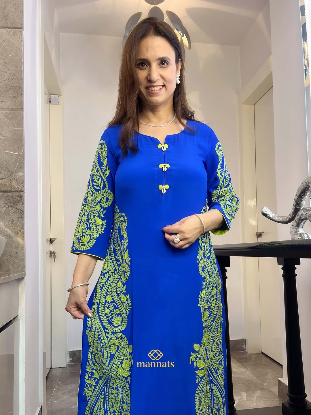 Blue pure georgette suit adorned with intricate thread embroidery, offering a perfect blend of e