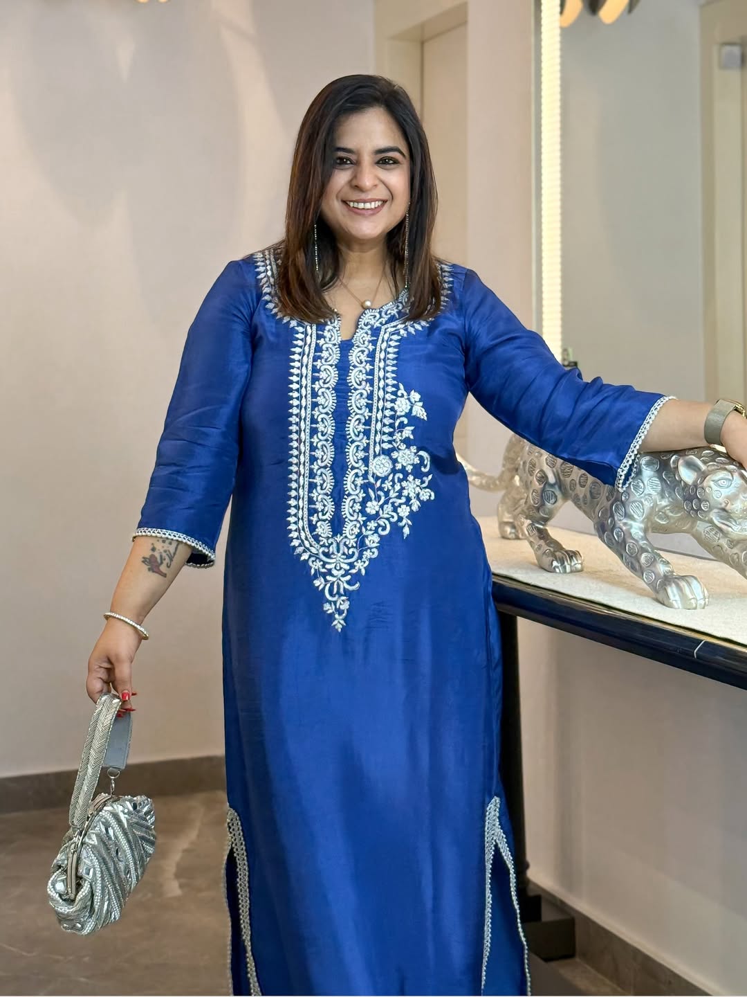 This long Indo-Western dress is crafted from premium fabric, featuring intricate hand embroidery (1)